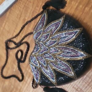 Vintage sequin evening bag with black bead chain drop is 23 in.  Snap closure bl